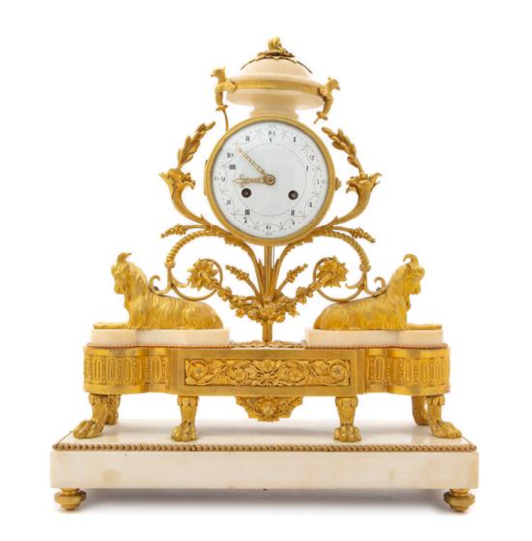 A French Gilt Bronze and Marble Mantel Clock with a (1 of 2)