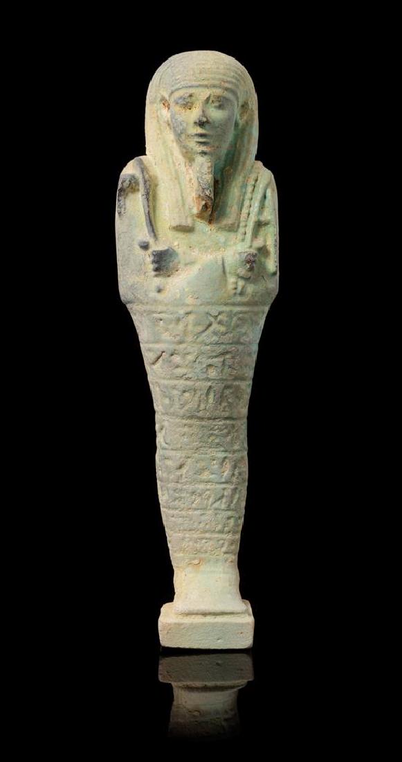 * An Egyptian Faience Shabti Height 9 1/2 inches.: * An Egyptian Faience Shabti late period, dynasty 26, 664-525 b.c.e. Height 9 1/2 inches. Estimate $2,000-3,000 Property from the Estate of Bernard A. Edison, St. Louis, Missouri