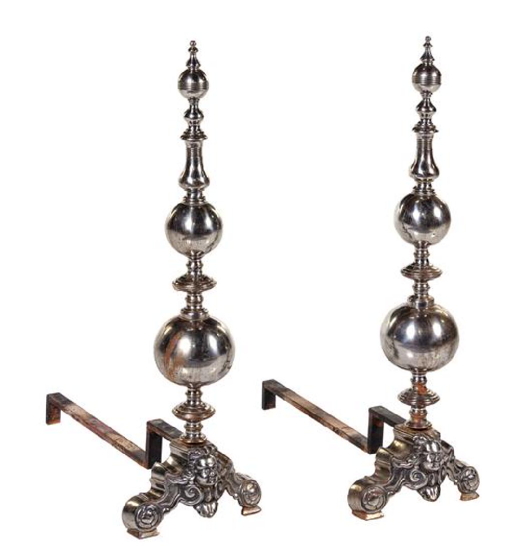 A Pair of Baroque Style Pewter Andirons Height 35 x: A Pair of Baroque Style Pewter Andirons 19th century each having a knopped stem, the base centered with a male mask. Height 35 x depth 24 1/2 inches. Estimate $400-600 Property from the Estate of Arle