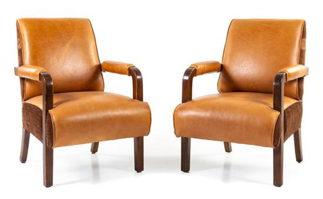 A Pair of Leather Upholstered Pullman Car Armchairs (1 of 1)