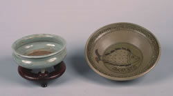 A Chinese Incised Celadon Glazed Earthenware Bowl,: A Chinese Incised Celadon Glazed Earthenware Bowl, together with a celadon glazed ceramic bowl with fish design. Diameter of largest 10 1/2 inches.
