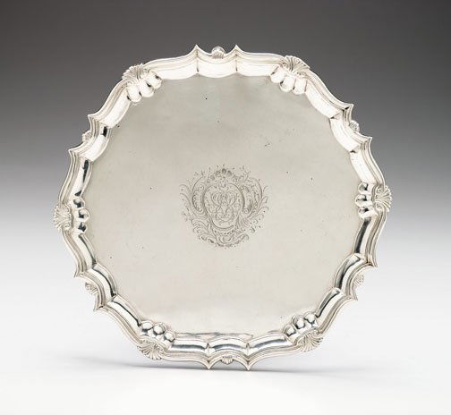George II sterling silver salver, probably robert: George II sterling silver salver probably robert abecromby, london, 1742 The shell cast border centered by a monogrammed coat of arms, raised on pad feet. Diam: 12 1/2 in. 32 oz.
