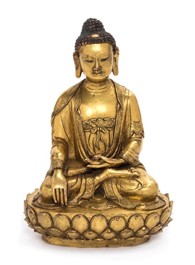 A Sino-Tibetan Gilt Bronze Figure of Shakyamuni Buddha (1 of 2)