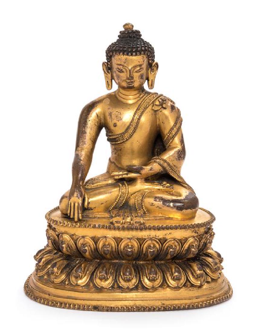 A Sino-Tibetan Gilt Bronze Figure of Shakyamuni Buddha (1 of 2)