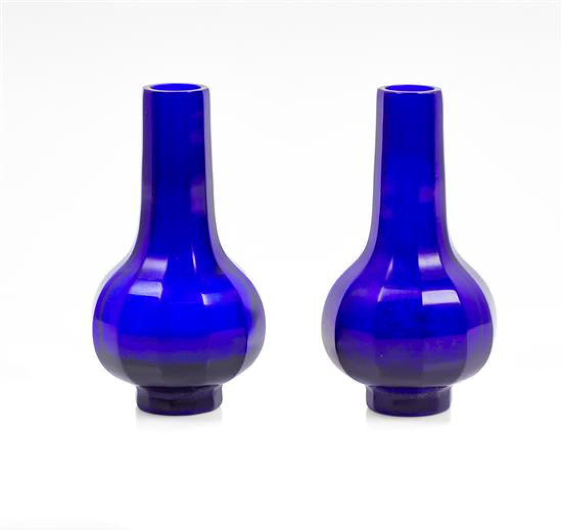 * A Pair of CobaltBlue Glass Faceted Bottle Vases
