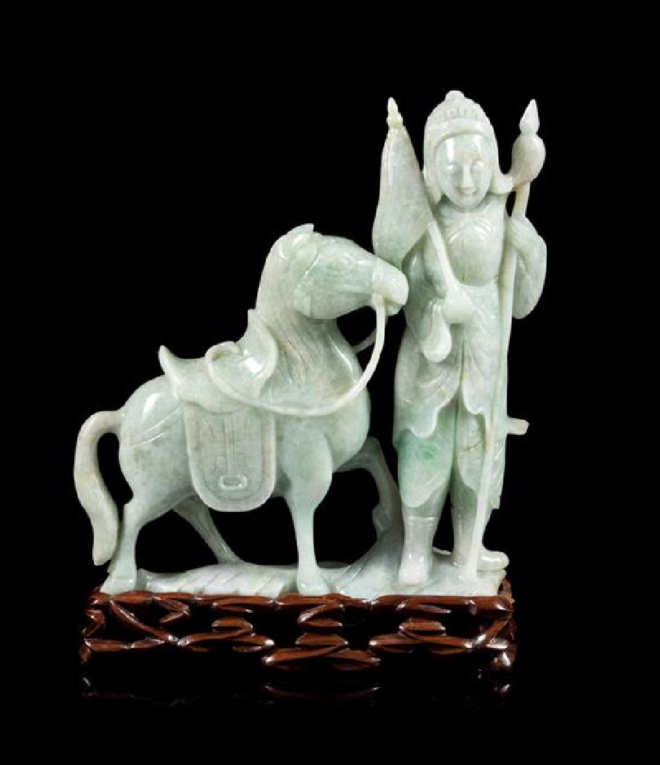 * A Green Jadeite Figural Group of a Warrior and a: * A Green Jadeite Figural Group of a Warrior and a Horse 20th century the warrior figure depicted standing with both arms bearing weapons, the horse standing next to him, raised on a fitted hardwood s