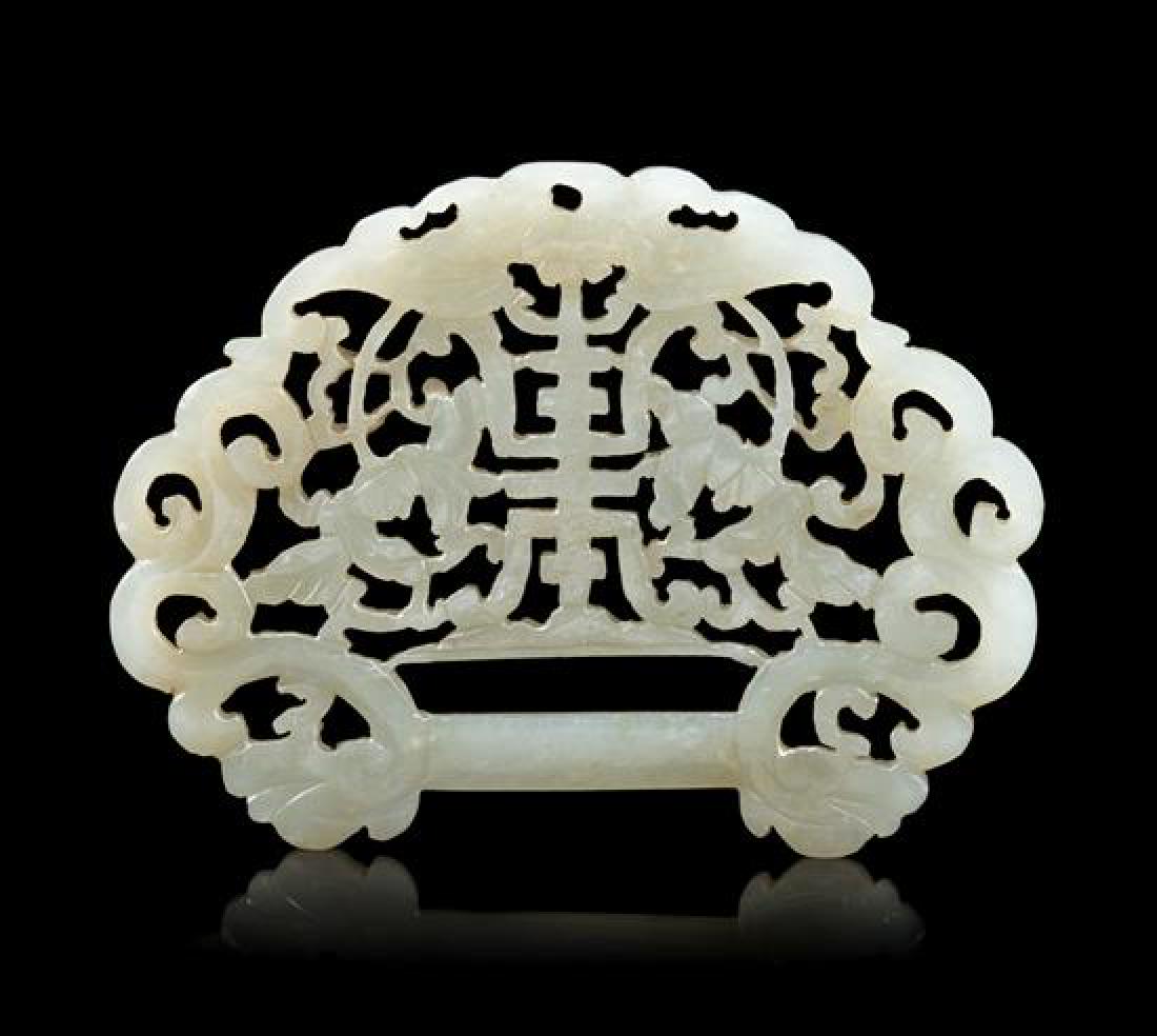 A Celadon Jade Ruyi- Head Openwork Lock Length 3 1/8: A Celadon Jade Ruyi- Head Openwork Lock 19th century carved and pierced with a shou character amongst scrolling peony sprays and foliage. Length 3 1/8 inches. Estimate $800-1,200 Property from an Impo