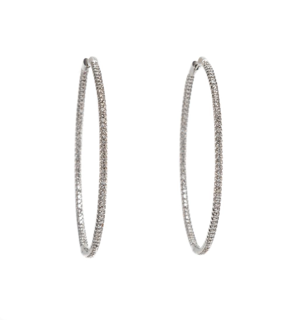A Pair of 18 Karat White Gold and Diamond Hoop: A Pair of 18 Karat White Gold and Diamond Hoop Earrings, Roberto Coin, containing 184 round brilliant cut diamonds weighing approximately 1.84 carats total in an inside out style. Stamp: (Italian hall