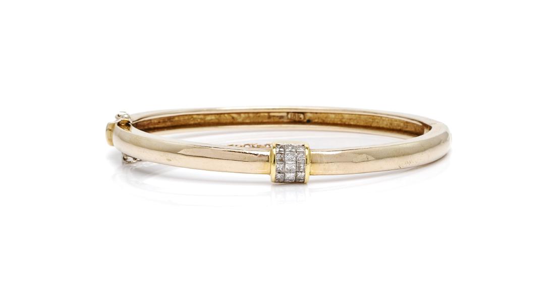An 18 Karat Yellow Gold and Diamond Bangle Bracelet,: An 18 Karat Yellow Gold and Diamond Bangle Bracelet, containing 15 princess cut diamonds weighing approximately 0.35 carat total, hinged with side clasp and safety chain. Stamp: 18K. 19.00 dwts. Estim