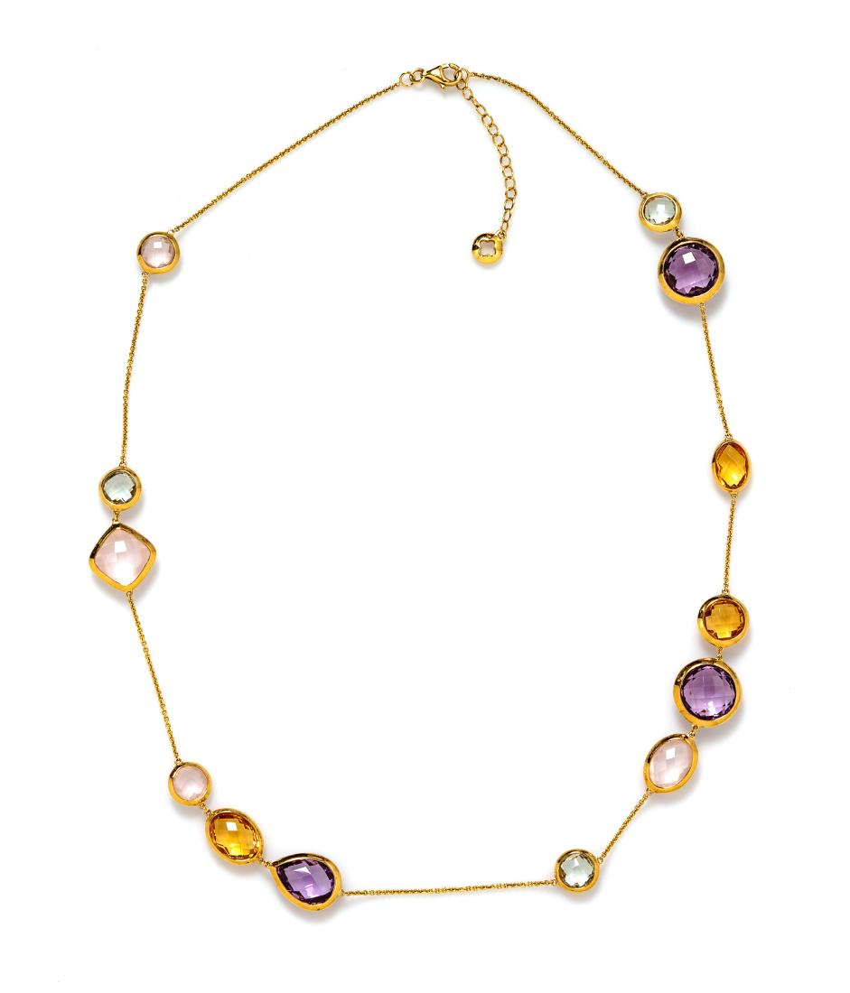 * An 18 Karat Yellow Gold and Multigem Station