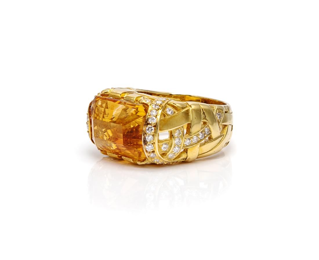 * An 18 Karat Yellow Gold, Citrine and Diamond Ring,: * An 18 Karat Yellow Gold, Citrine and Diamond Ring, Marlene Stowe, containing one octagonal step cut citrine measuring approximately 15.75 x 11.30 x 10.05 mm and 54 round brilliant cut diamonds weigh