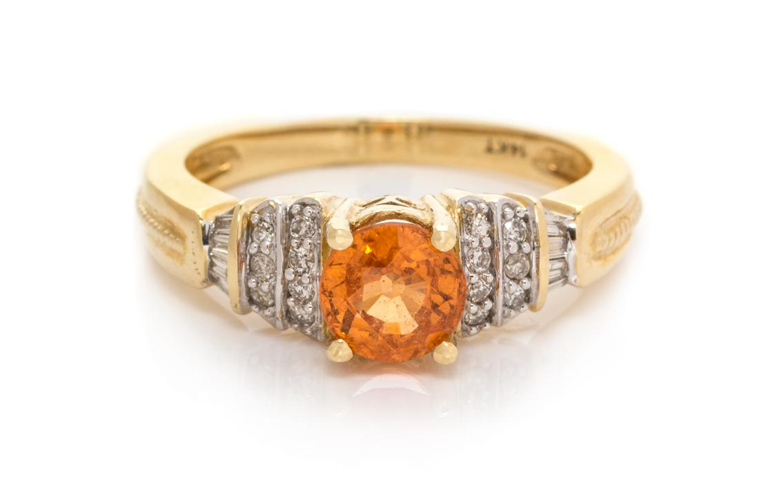 A 14 Karat Yellow Gold, Spessartite Garnet and Diamond: A 14 Karat Yellow Gold, Spessartite Garnet and Diamond Ring, containing one round mixed cut spessartite garnet measuring approximately 6.10 mm in diameter, 14 round brilliant cut diamonds weighing app
