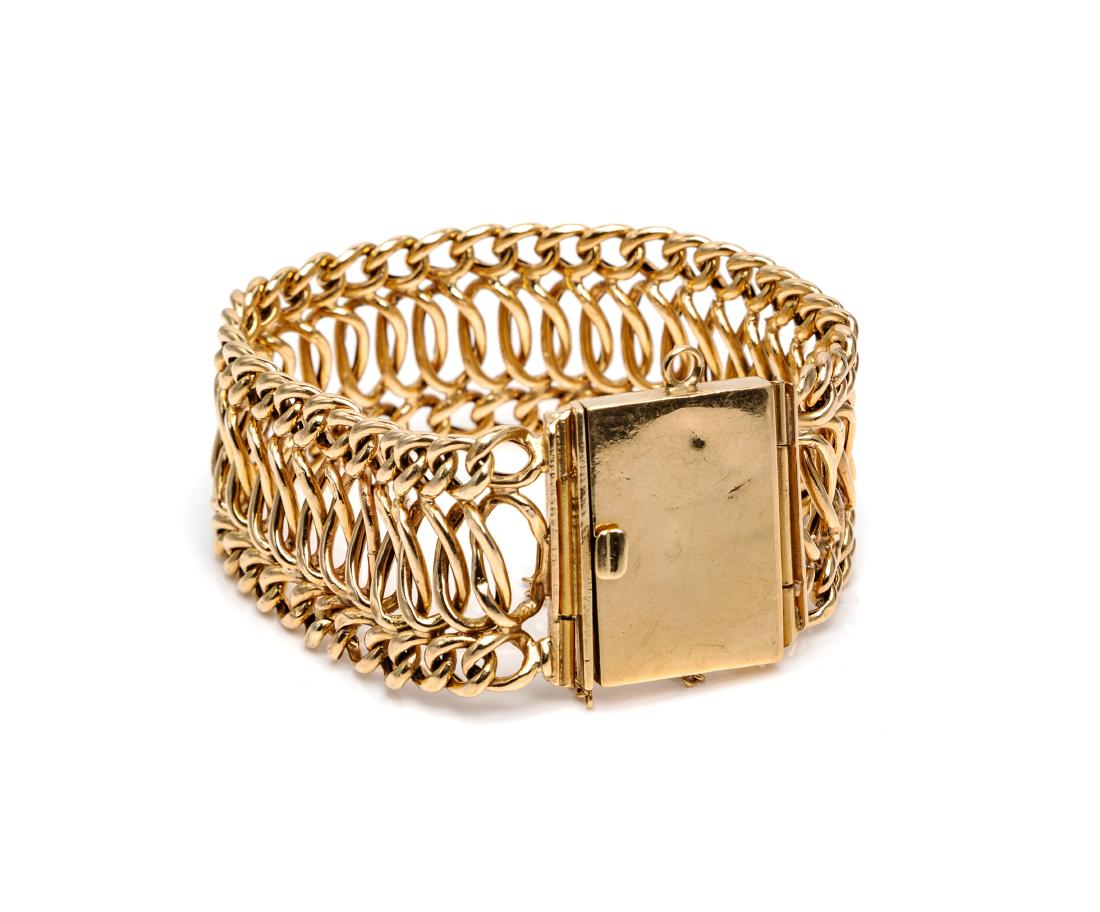 * A 14 Karat Yellow Gold Bracelet, 19.20 dwts.: * A 14 Karat Yellow Gold Bracelet, consisting of a three row hollow fancy link chain measuring approximately 23.00 mm wide, rectangular box clasp with safety chain. Stamp: 14K. 19.20 dwts. Estimate $4