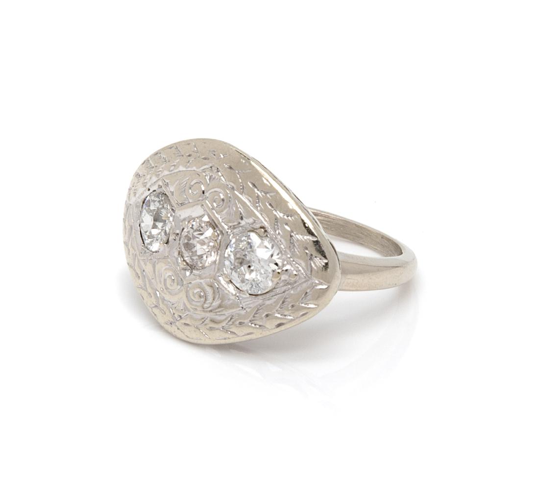* A White Gold and Diamond Ring, 2.90 dwts.: * A White Gold and Diamond Ring, containing three old European cut diamonds weighing approximately 0.75 carat total. 2.90 dwts. Estimate $300-500 Property from The Violet Soffer Trust, Boca Raton, Flo
