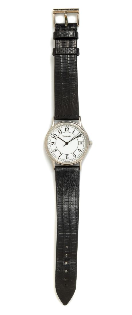 A Stainless Steel 'Portfolio' Wristwatch, Tiffany &: A Stainless Steel 'Portfolio' Wristwatch, Tiffany & Co., 33.00 mm case diameter, white dial signed TIFFANY & Co., black Arabic numerals, black pencil hands with center seconds hand, date aperture at 3