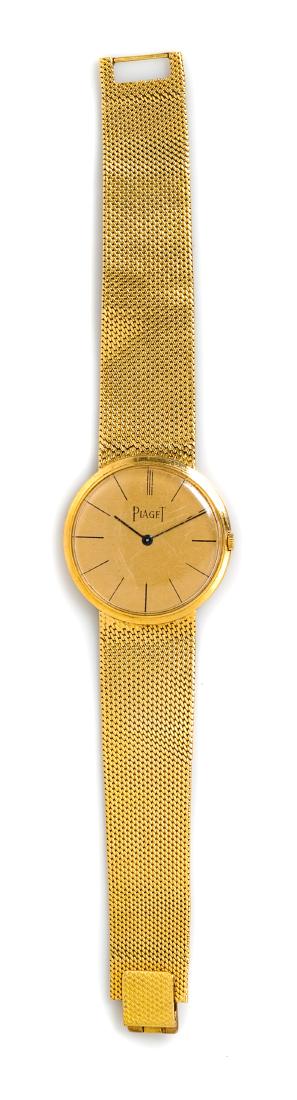 * An 18 Karat Yellow Gold Ref. 902B11 Wristwatch,: * An 18 Karat Yellow Gold Ref. 902B11 Wristwatch, Piaget, 31.00 mm case diameter, matte gold dial signed PIAGET, black baton numerals, blued steel baton hands, snap on personalized and engraved case b