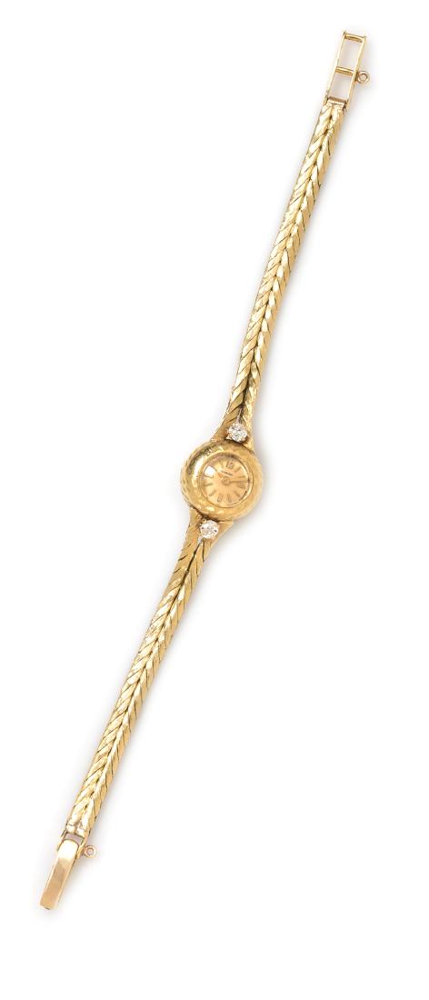 An 18 Karat Yellow Gold and Diamond Wristwatch,: An 18 Karat Yellow Gold and Diamond Wristwatch, Blancpain the lugs containing two old European cut diamonds weighing approximately 0.18 carat total, 13.00 mm case diameter, champagne dial signed BLANC