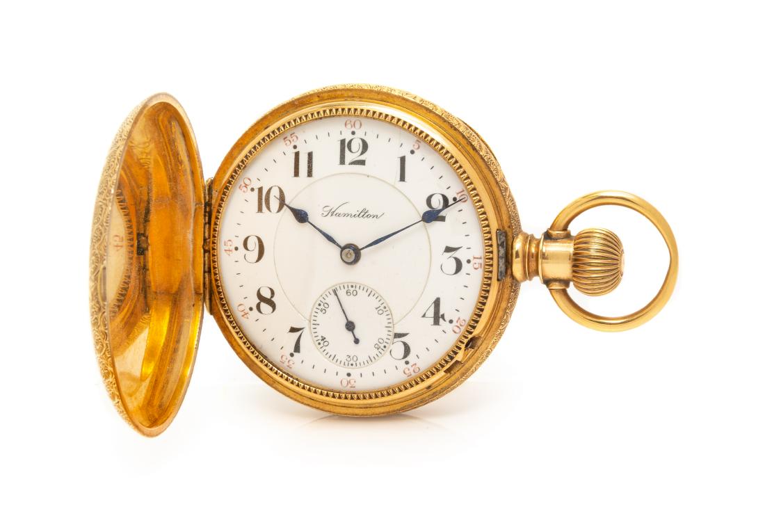 A 14 Karat Yellow Gold Open Face Pocket Watch,: A 14 Karat Yellow Gold Open Face Pocket Watch, Hamilton, Circa 1907, 49.00 mm case diameter, white double sunk dial signed Hamilton, black Arabic numerals with red outer chapter ring calibrated to 60 