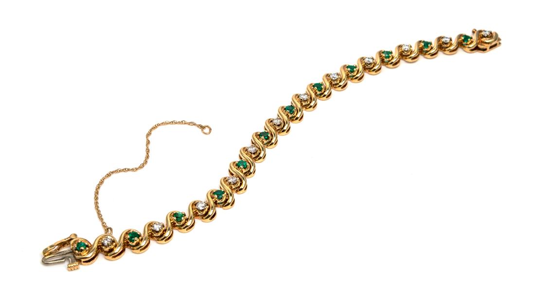 A 14 Karat Yellow Gold, Diamond and Emerald Bracelet,: A 14 Karat Yellow Gold, Diamond and Emerald Bracelet, containing 12 round brilliant cut diamonds weighing approximately 0.95 carat total and 12 round mixed cut emeralds measuring approximately 2.80 mm