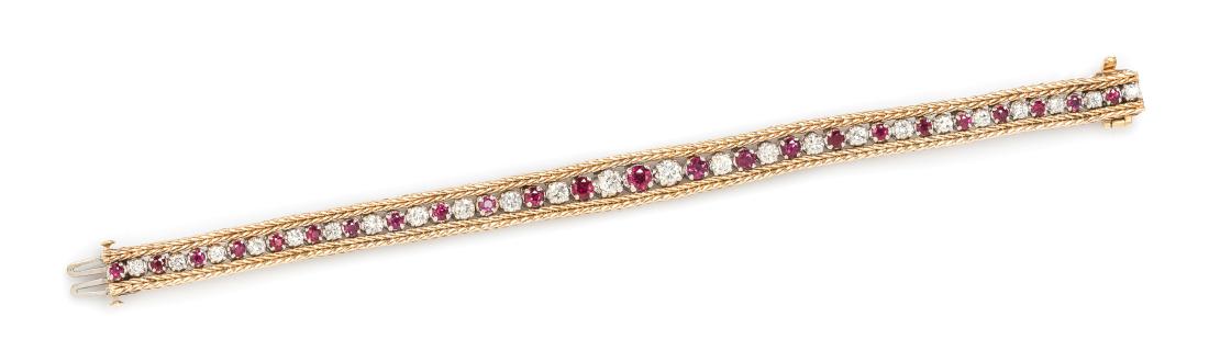 A 14 Karat Bicolor Gold, Diamond and Ruby Bracelet,: A 14 Karat Bicolor Gold, Diamond and Ruby Bracelet, containing 24 round brilliant cut diamonds weighing approximately 1.90 carats and 24 round mixed cut rubies weighing approximately 2.10 carats total