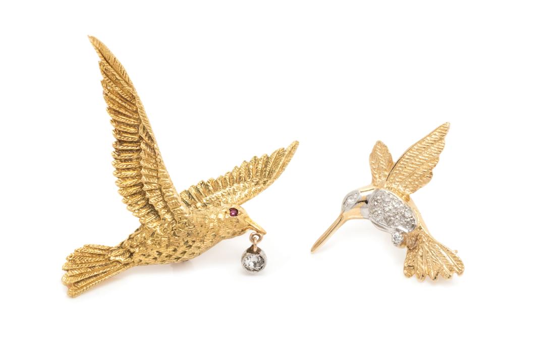 A Collection of Yellow Gold, Diamond and Ruby Bird: A Collection of Yellow Gold, Diamond and Ruby Bird Motif Brooches, consisting of a 14 karat gold hummingbird brooch containing 11 round single cut diamond weighing approximately 0.06 carat total and a