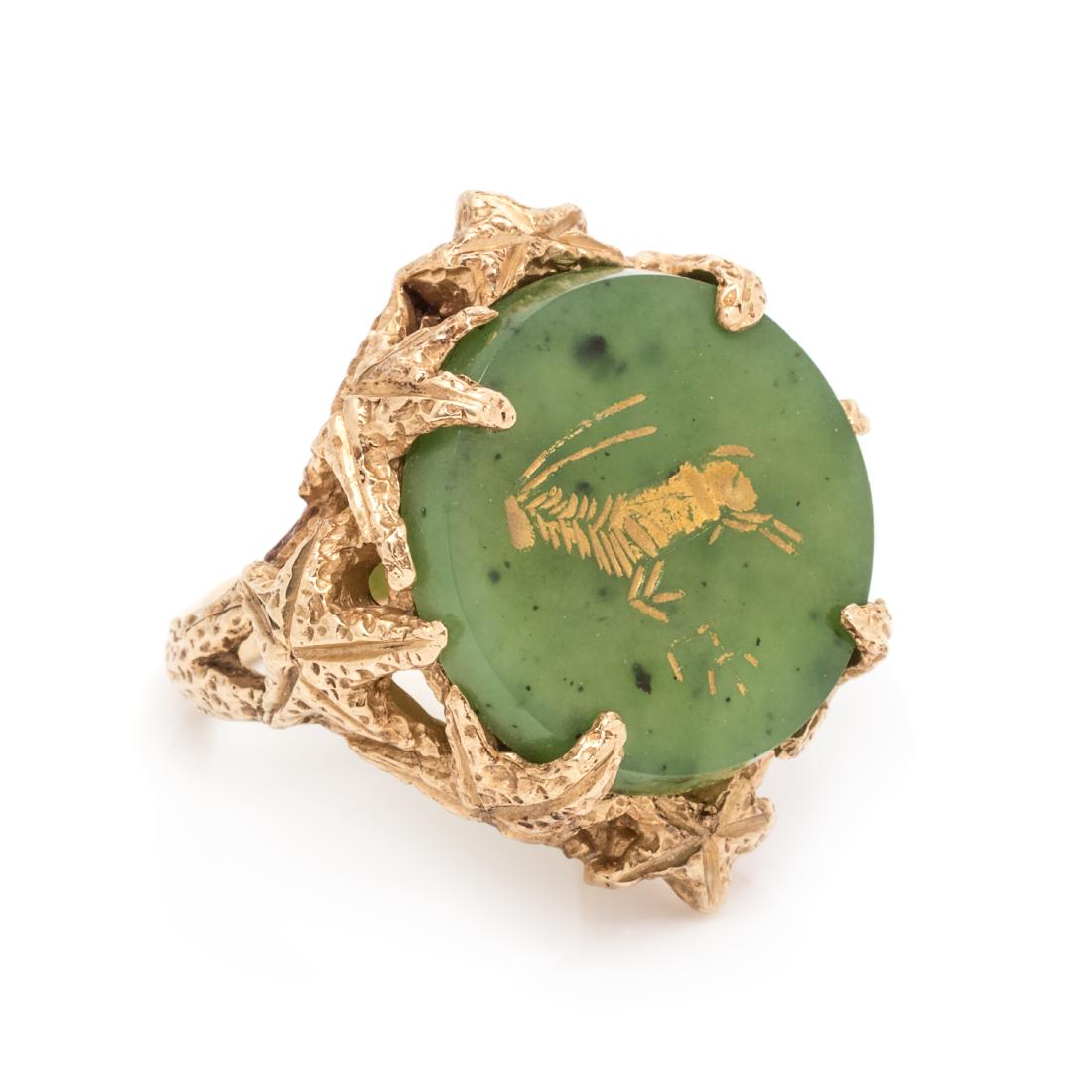A 14 Karat Yellow Gold and Nephrite Intaglio Ring,: A 14 Karat Yellow Gold and Nephrite Intaglio Ring, containing one round nephrite intaglio plaque measuring approximately 20.00 mm in diameter with a gold painted animal intaglio. Stamp: 14K EBL. 10.00
