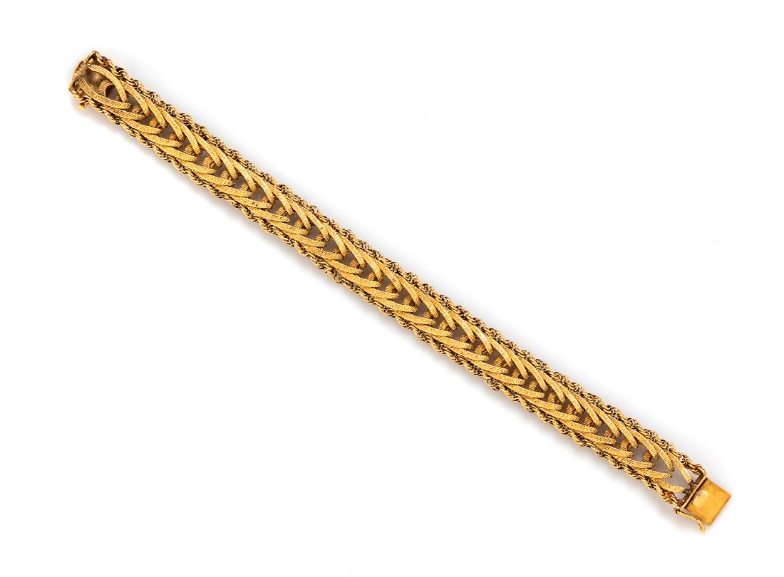 * A 14 Karat Yellow Gold Bracelet, 20.30 dwts.: * A 14 Karat Yellow Gold Bracelet, consisting of a textured herringbone chain with rope chain border measuring approximately 12.00 mm wide. Stamp: 14K. 20.30 dwts. Estimate $500-700 Property from the 
