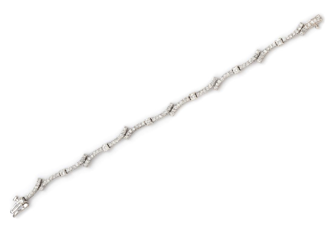 An 18 Karat White Gold and Diamond Bracelet, 9.00 dwts.: An 18 Karat White Gold and Diamond Bracelet, containing seven round brilliant cut diamonds weighing approximately 0.77 carat total and 98 round brilliant cut diamonds weighing approximately 1.96 carat