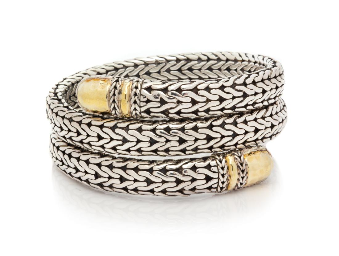 * A Sterling Silver and 22 Karat Yellow Gold 'Palu': * A Sterling Silver and 22 Karat Yellow Gold 'Palu' Coil Bracelet, John Hardy, in a triple coil design with gold finial accents. Stamp: (John Hardy maker's mark) M .22K 925. 55.10 dwts. Estimate $300-