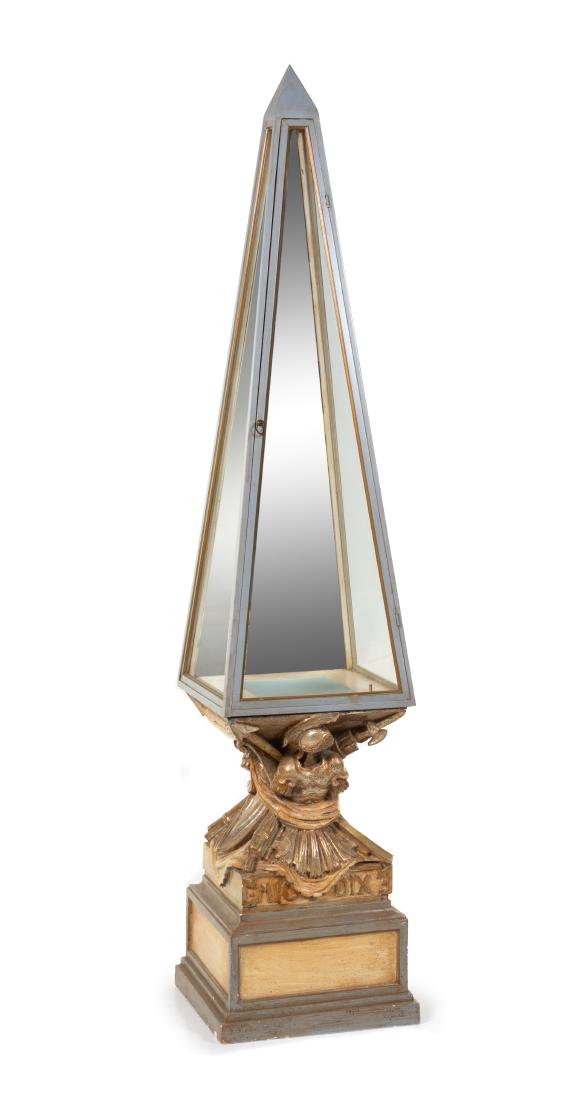 A Painted Plaster Obelisk Lighting Fixture Height: A Painted Plaster Obelisk Lighting Fixture in two parts. Height overall 74 inches. Estimate $80-120