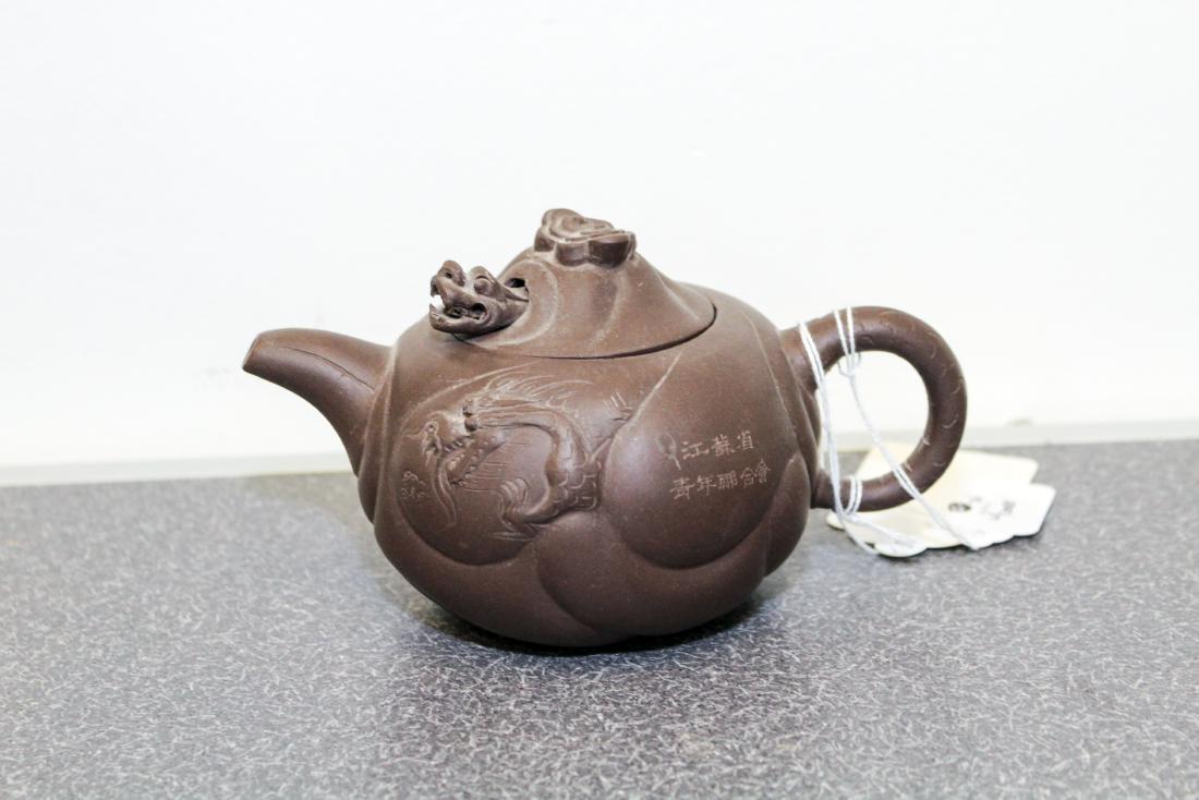 A Yixing Purple Stoneware Teapot and Cover Width 6 1/2 (1 of 1)