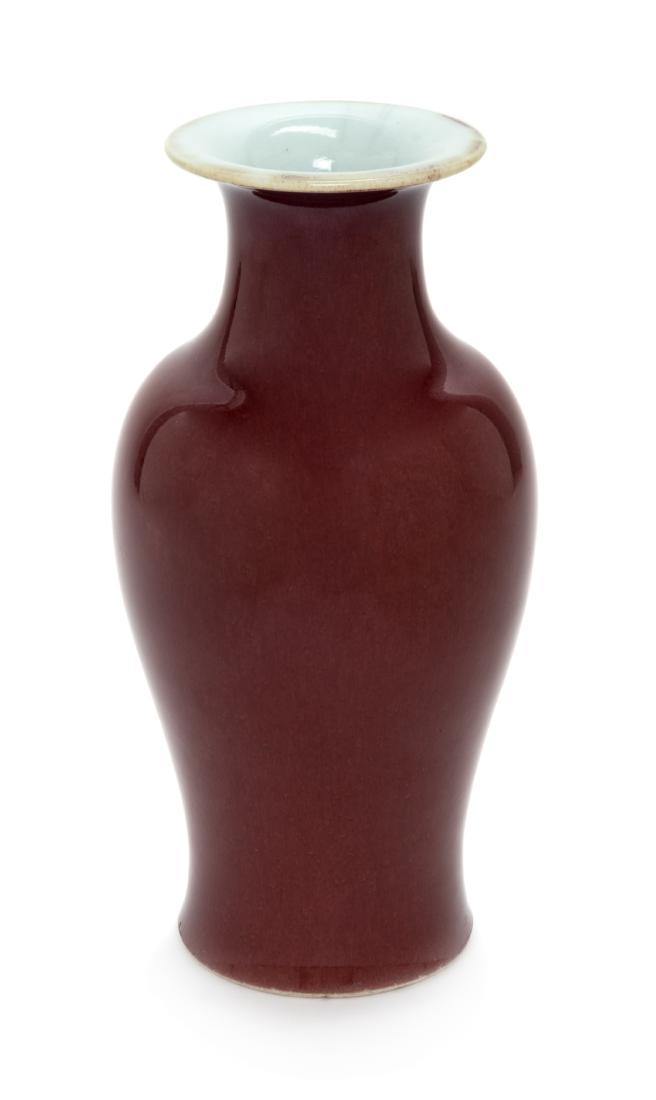* A Chinese Sang-de-Boeuf Glazed Porcelain Vase Height: * A Chinese Sang-de-Boeuf Glazed Porcelain Vase late 19th/early 20th century Height 9 1/2 inches. Estimate $200-400 Property from the Collection of the Halim Time and Glass Museum, Evanston, Illinois