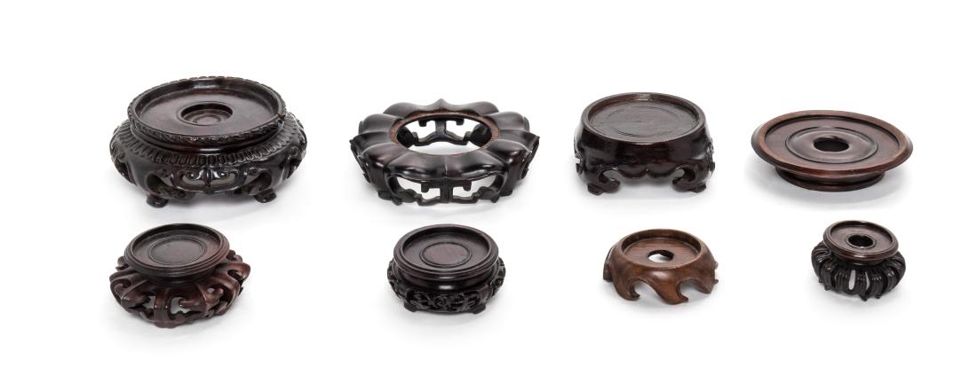 Eight Chinese Hardwood Stands Diameter of largest 3 1/2 (1 of 1)