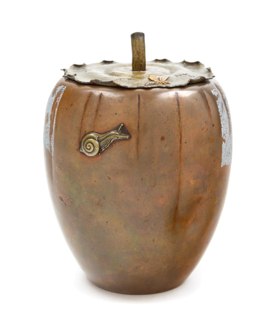 * A Japanese Mixed Metal Melon-Form Vessel Height 7: * A Japanese Mixed Metal Melon-Form Vessel 19th century the ovoid body cast with raised crabs. Height 7 inches. Estimate $300-500 Property from the Estate of William Lipton, New York, New York