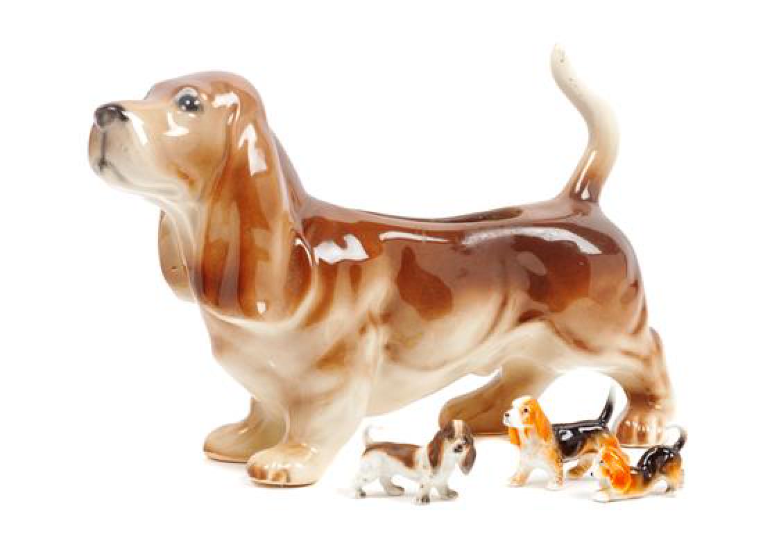 * A Group of Four Basset Hound Ceramic Figures Width of: * A Group of Four Basset Hound Ceramic Figures comprising a planter and three small figures together with a framed watercolor; 5 items total. Width of widest 11 1/2 inches. Estimate $60-80 Property fr