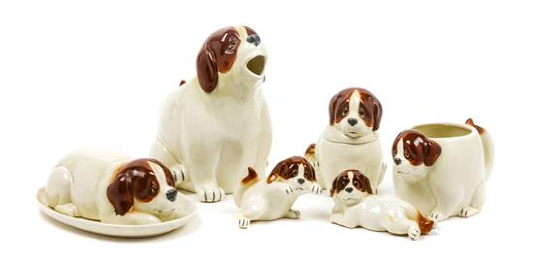 * A Group of Six Saint Bernard Table Articles Height of: * A Group of Six Saint Bernard Table Articles quon-quon comprising a pitcher, handled bowl, lidded sugar, butter dish, and salt and pepper shakers. Height of tallest 7 1/2 inches. Estimate $80-120 Pro