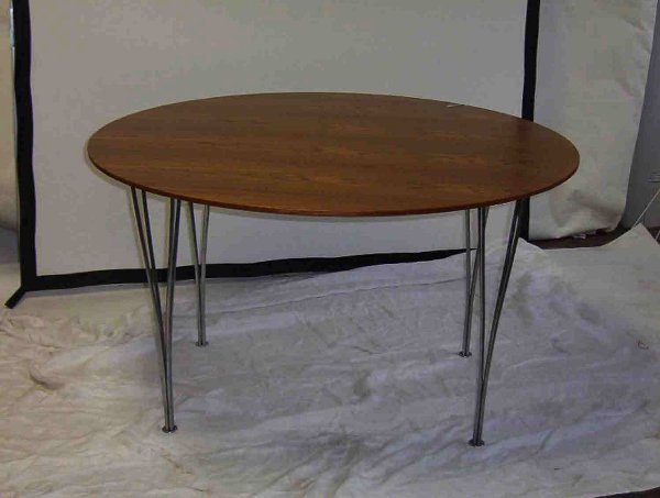 BRUNO MATHSSON FOR FRITZ HANSEN CIRCULAR DINING T: BRUNO MATHSSON FOR FRITZ HANSEN CIRCULAR DINING TABLE Walnut top on chromed steel legs. H: 27 1/2, Dia: 47 1/2 in.