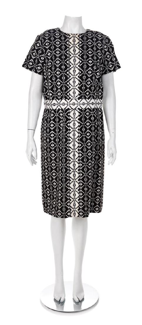 Elaine Ames Black and White Cotton Ensemble, 1960s: Elaine Ames Two-Piece Black and White Geometric Cotton Ensemble, 1960s The jacket has a collar and label, long sleeves, red lining and a center front snap closure. The dress has a scoop neckline, cap