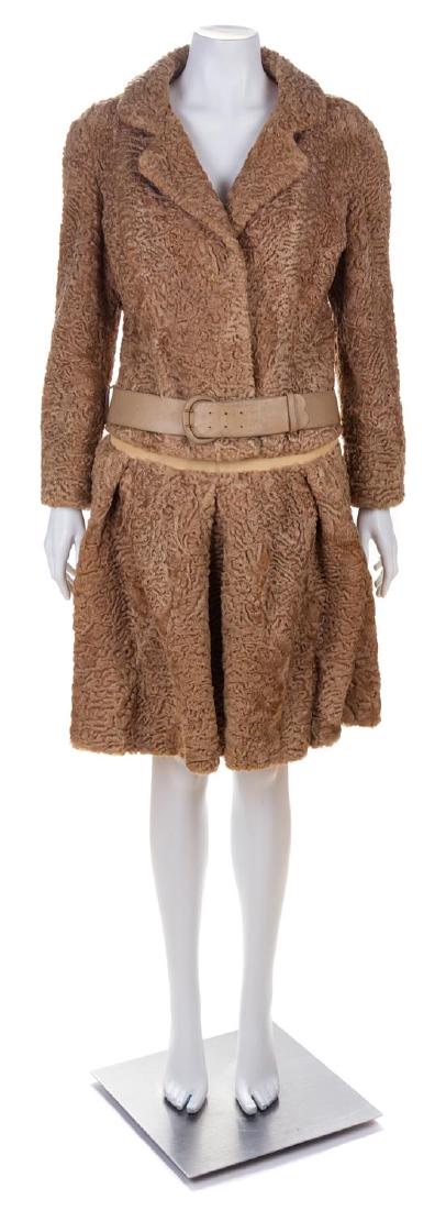 * A Bergdorf Goodman Persian Lamb Skirt Suit, 1960-70s: * A Bergdorf Goodman Tan Persian Lamb Fur Skirt Suit, 1960-70s Jacket with a notched collar, removable leather belt at the hip and button front closure. With a drop waist pleated mini skirt with a fro