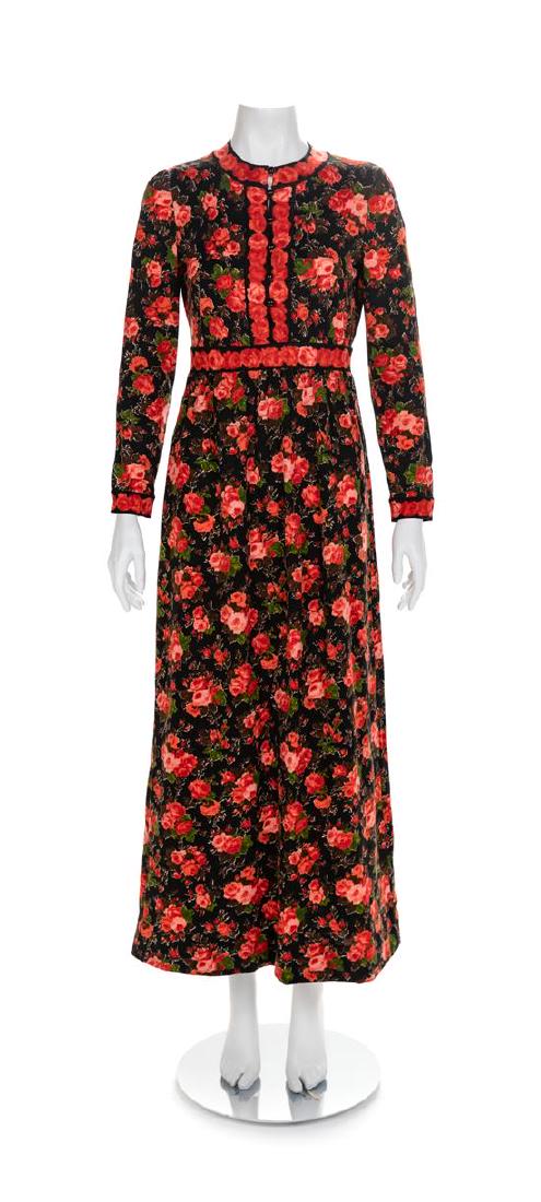 Goldworm Black & Red Floral Patterned Dress, 1960-70s: Goldworm Black Red and Floral Patterned Dress, 1960-70s Dress has a crew neckline, long sleeves, center front closure with buttons and self fabric loops to the waistline. Maxi skirt gathered into the 