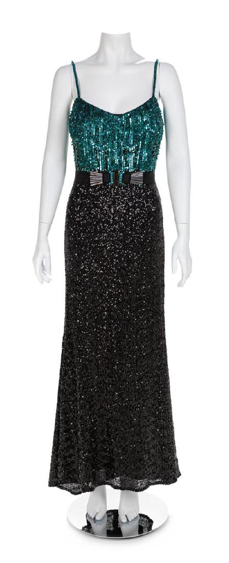 Badgley Mischka Evening Dress, 1990s Size label: 8: Badgley Mischka Evening Dress, 1990s Floorlength dress with a bodice of green sequins, glass beads and thin shoulder straps. The fitted and flared skirt is covered with black sequins and secured at th