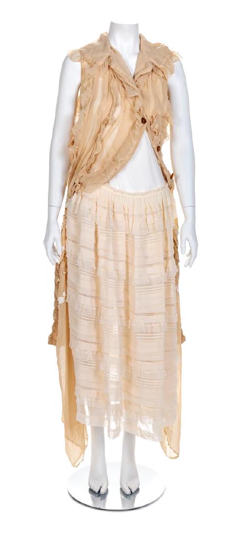 Comme des Garçons 'Broken Bride' Ensemble, F/W 2005: Comme des Garçons 'Broken Bride' Ensemble, F/W 2005 The irregular blouse is made of tan sheer polyester and lace with tucks, self-fabric bows and embellished with ribbon flowers and applique. The bod