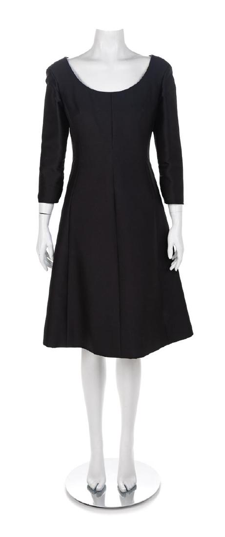 Christian Dior Princess Cut Dress with Jacket, 1950s: Christian Dior Black Princess Cut Dress with Jacket, 1950s The dress and jacket are made of black wool suiting. The jacket has a scoopneck and three-quarter sleeves. Three large buttons down the cente
