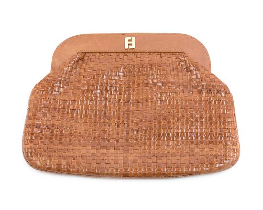 Fendi Brown Handbag, 1980-90s: Fendi Brown Handbag, 1980-90s The bag is in good condition with scratches on the leather frame and marks on the leather lining. These condition issues can be seen in the images attached the listing. E