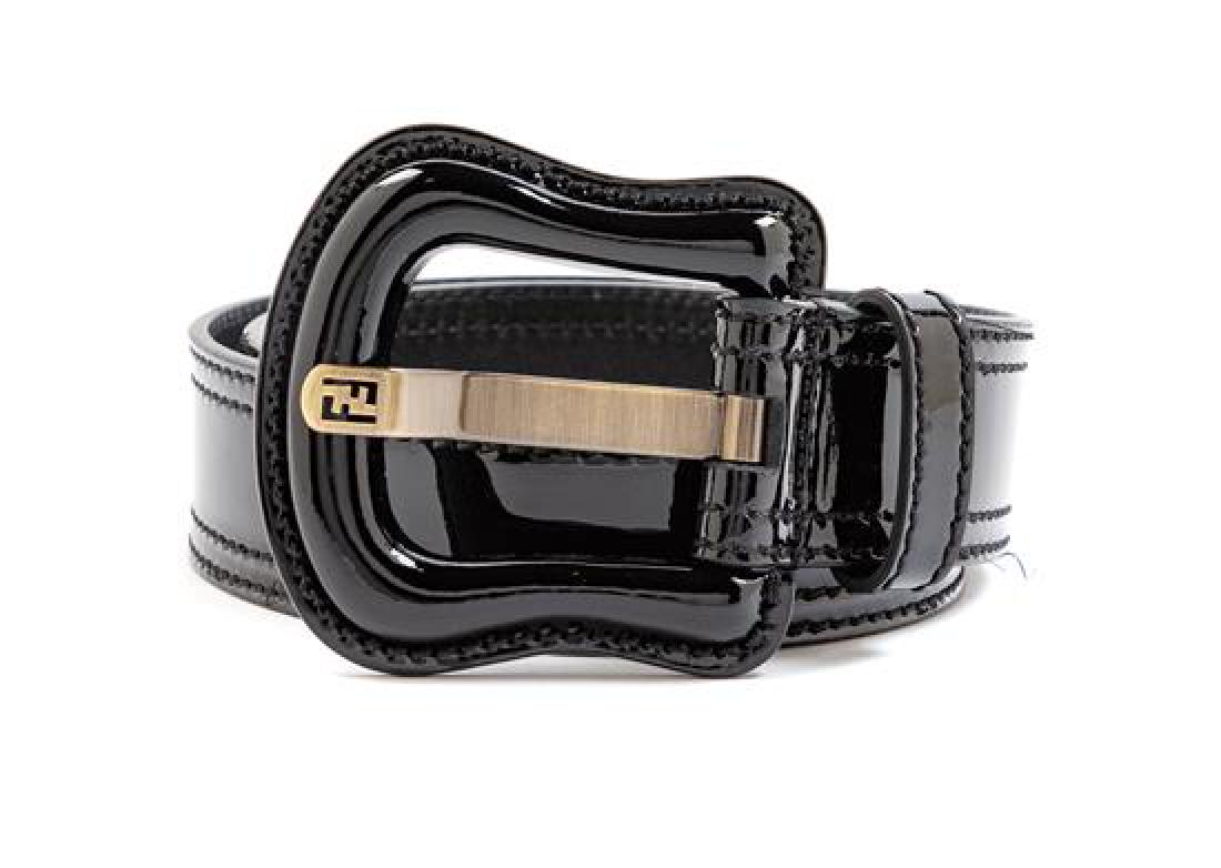Fendi Patent Belt with Large Buckle, 1990-2000s: Fendi Patent Belt with Large Buckle, 1990-2000s Stamp: Fendi Together with a dustbag. Estimate $80-100 The stated overall condition of the lot is based on the assumption that the wear is consistent wi