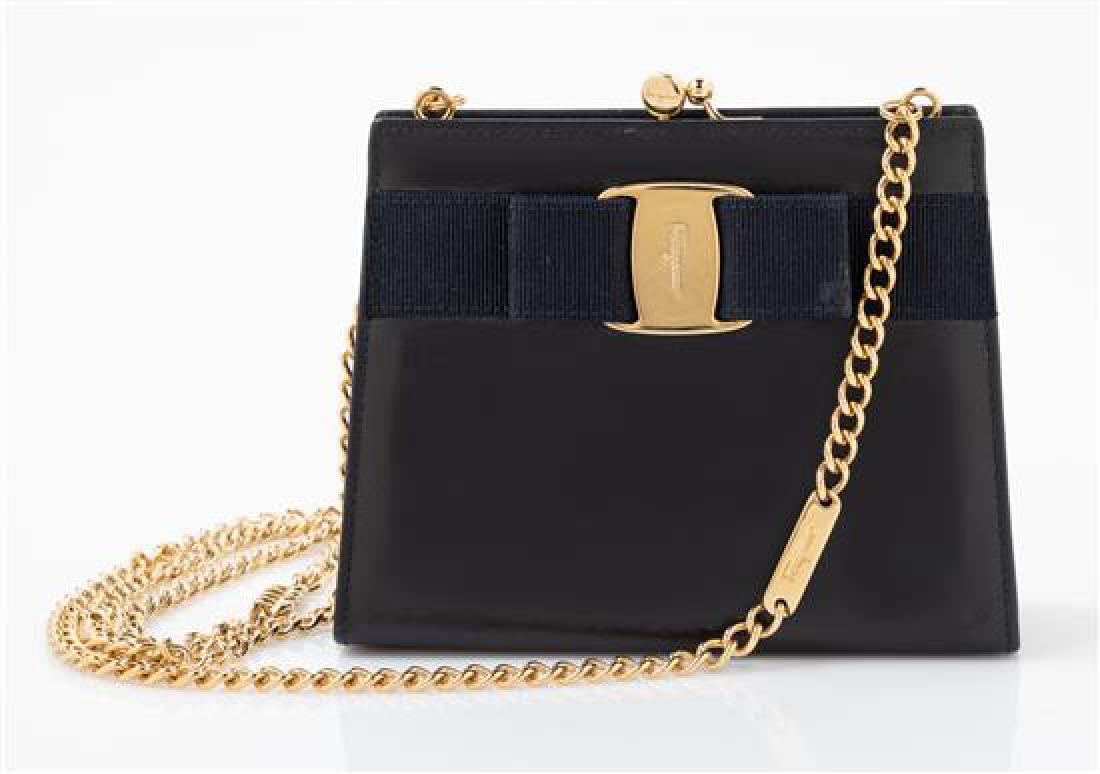 Salvatore Ferragamo Black Leather Handbag 1990-2000s: Salvatore Ferragamo Black Leather Handbag with Bow, 1990-2000s Together with a box. Stamp: Salvatore Ferragamo Estimate $100-200