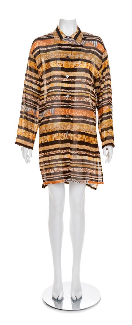 Ferragamo Cotton Tunic, 1990-2000s Size label: Small: Ferragamo Cotton Tunic, 1990-2000s Cotton collared tunic with a button up front, two front pockets and an animal print motif throughout. Label: Ferragamo Size label: Small Estimate $80-120 Overall goo