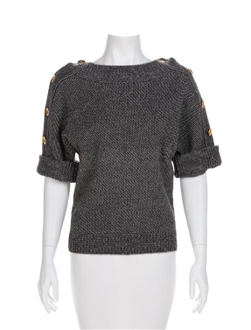 Gucci Black and Gray Sweater, 1990-2000s: Gucci Black and Gray Sweater, 1990-2000s 100% Camel hair Condition of the sweater is good with one small hole at the center front waistline. Estimate $100-200 Approximate Flat Measurements Across the