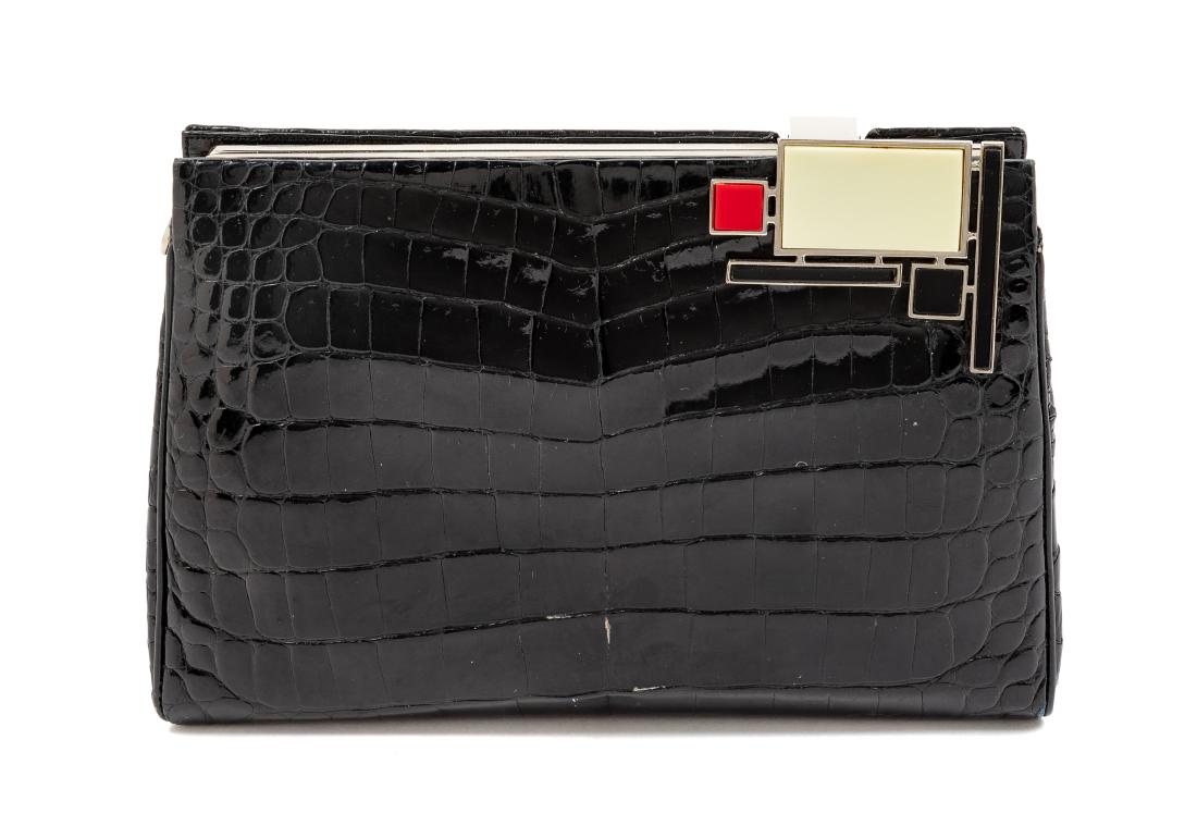 * Judith Leiber Black Crocodile Bag: * Judith Leiber Black Crocodile Bag silvertone hardware with a Mondrian-inspired push/lift clasp, together with a removable skin shoulder strap. Label: Judith Leiber © Estimate $150-250 Property from