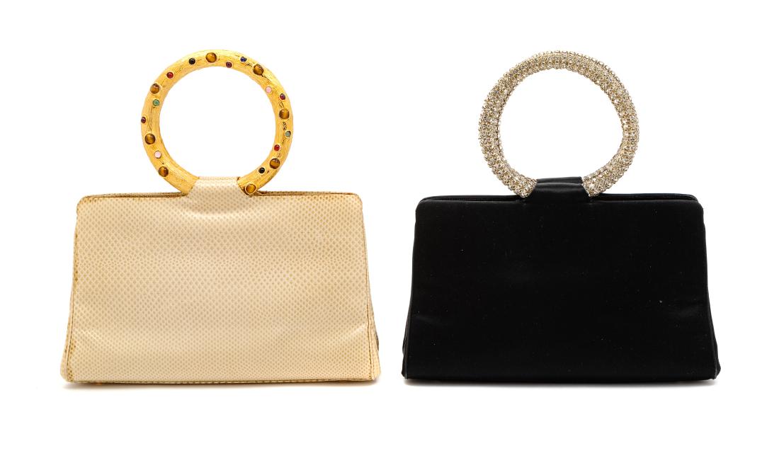 * Two Judith Leiber bags With Circular Handle: * Two Judith Leiber bags With Circular Handle, First: Black satin, silvertone hardware, clear rhinestone handle, interior black satin lining with interior front back slip pockets, and a middle compart